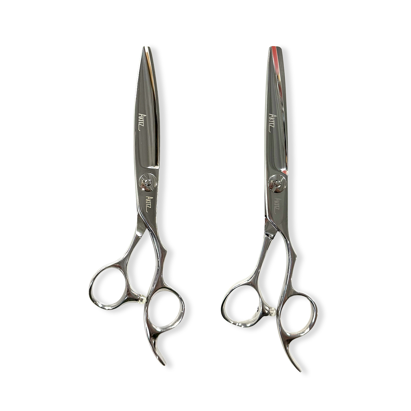 Pair of silver scissors on a white background